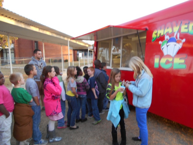 Students wait patiently in line for their shaved ice treats!